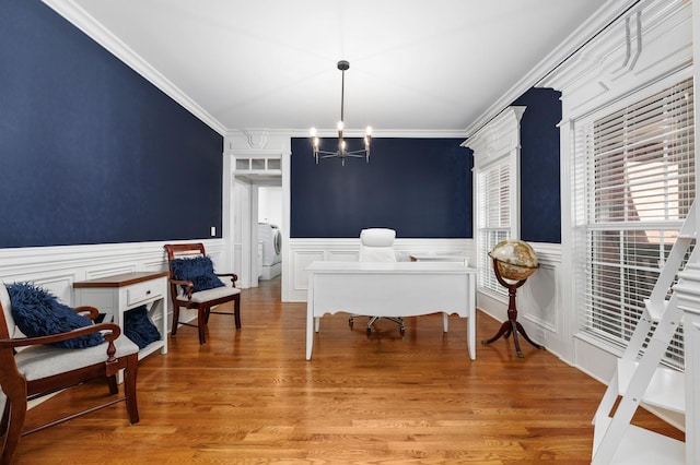 5417 Cavendish Dr, Murfreesboro, TN 37128 - dining space with crown molding, a chandelier, washer / dryer, wainscoting, and a decorative wall