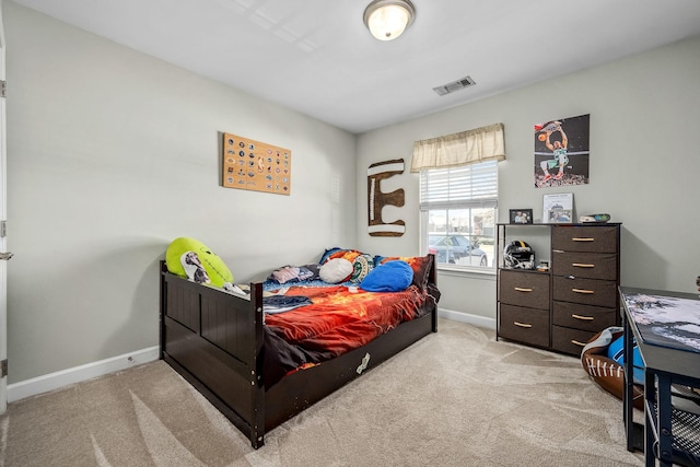 bedroom with carpet flooring and baseboards