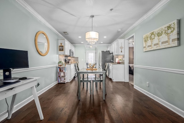 dining area featuring ornamental molding, recessed lighting, dark wood finished floors, baseboards, and a chandelier