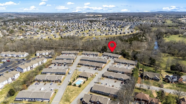 aerial view of property's location with nearby suburban area