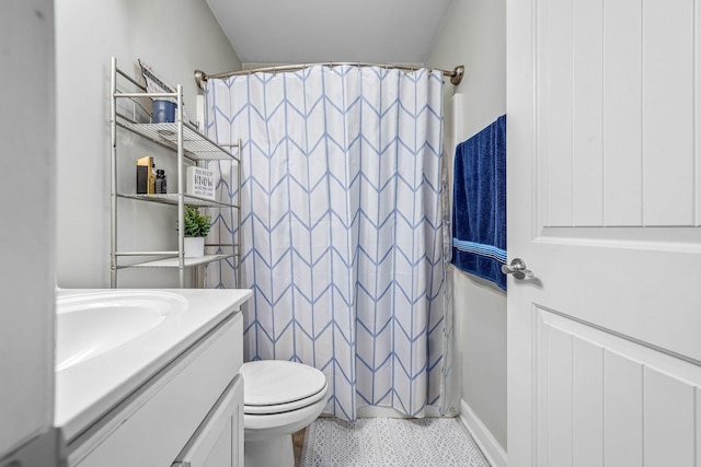 full bath featuring vanity, toilet, and curtained shower