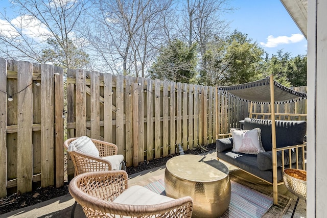 deck with a fenced backyard and a patio area
