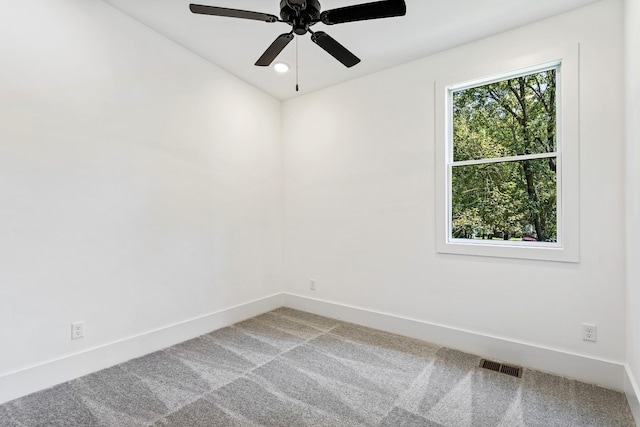 carpeted spare room featuring baseboards, a ceiling fan, and recessed lighting