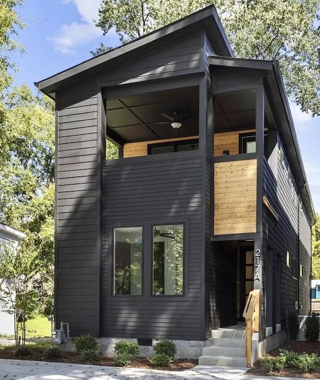 contemporary house featuring crawl space and a balcony