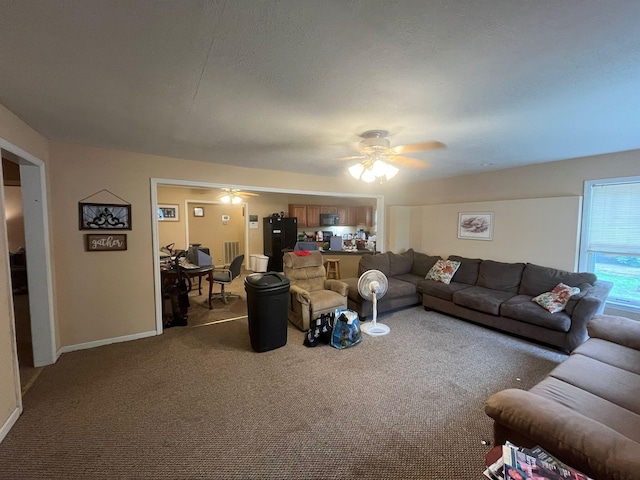 108 Butler Speedway, Bruceton, TN 38317 - living area with carpet flooring, ceiling fan, and baseboards