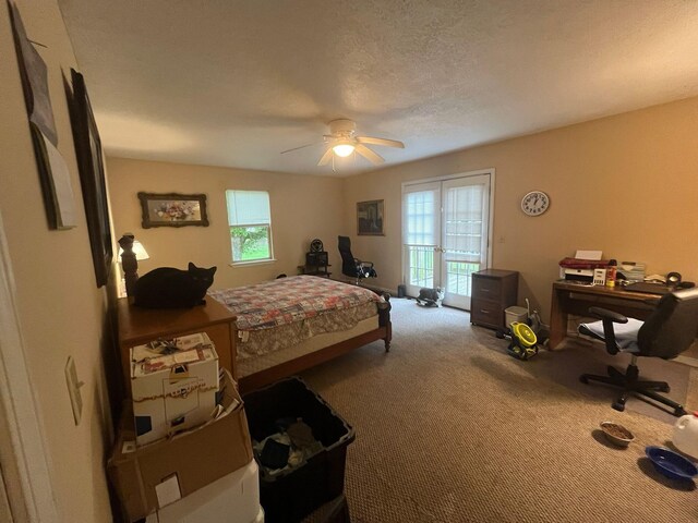 108 Butler Speedway, Bruceton, TN 38317 - bedroom with access to outside, carpet floors, a desk, and ceiling fan