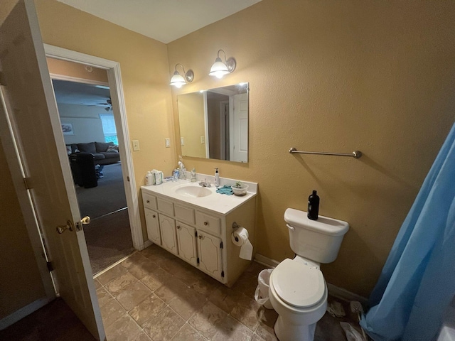 108 Butler Speedway, Bruceton, TN 38317 - bathroom with vanity, toilet, and a ceiling fan