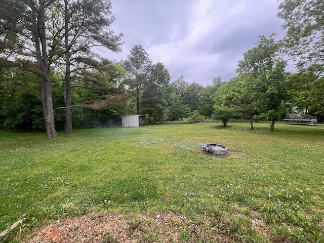 108 Butler Speedway, Bruceton, TN 38317 - view of green lawn with a fire pit