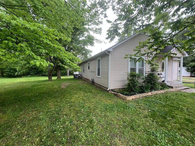 108 Butler Speedway, Bruceton, TN 38317 - view of side of home with a yard