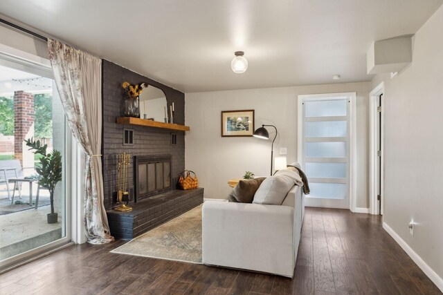 906 Temple Ct, Murfreesboro, TN 37130 - living area featuring dark wood-style flooring, baseboards, and a brick fireplace