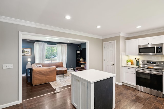 906 Temple Ct, Murfreesboro, TN 37130 - kitchen featuring stainless steel appliances, dark wood-style flooring, white cabinetry, light countertops, and crown molding