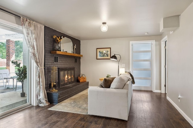 906 Temple Ct, Murfreesboro, TN 37130 - living area with dark wood finished floors, a brick fireplace, and baseboards