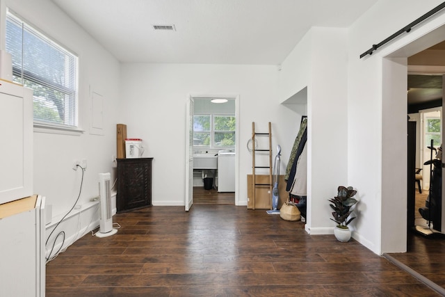 906 Temple Ct, Murfreesboro, TN 37130 - bedroom with a barn door, multiple windows, wood finished floors, and baseboards