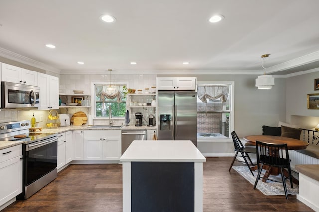 906 Temple Ct, Murfreesboro, TN 37130 - kitchen featuring appliances with stainless steel finishes, open shelves, a sink, ornamental molding, and tasteful backsplash