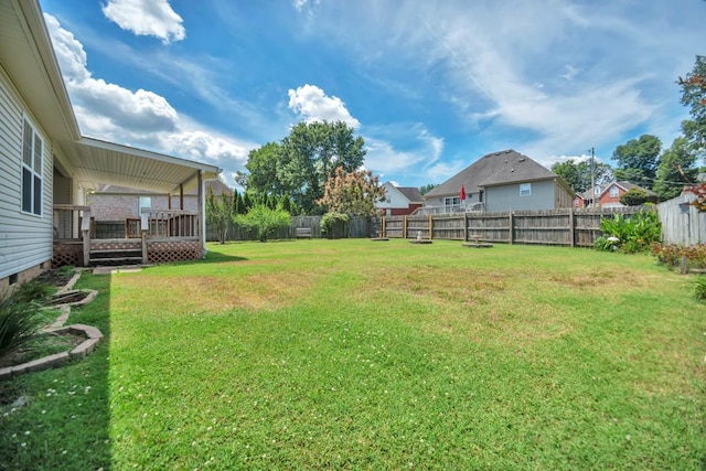 view of yard featuring a wooden deck