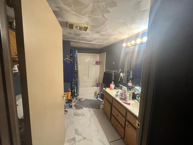 170 Keystone, Morris Chapel, TN 38361 - bathroom featuring marble look tiles, vanity, and shower / tub combo