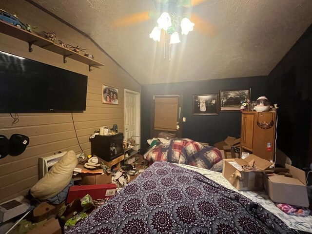 170 Keystone, Morris Chapel, TN 38361 - carpeted bedroom with lofted ceiling, wood walls, and a textured ceiling