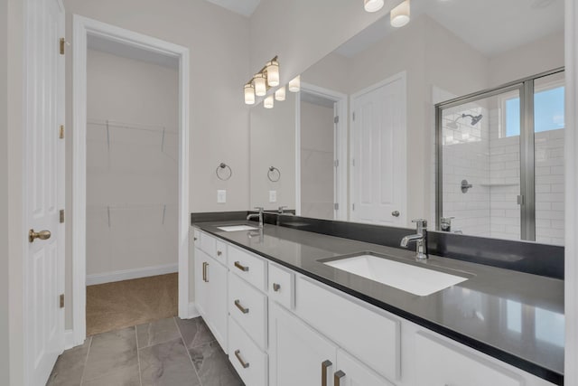 513 Perrin Aly, Antioch, TN 37013 - full bathroom featuring a shower stall, marble finish flooring, a spacious closet, double vanity, and baseboards