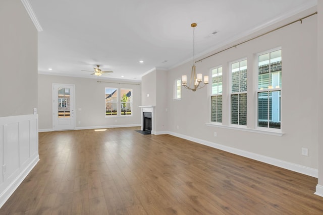 513 Perrin Aly, Antioch, TN 37013 - unfurnished living room with crown molding, wood finished floors, a chandelier, baseboards, and recessed lighting