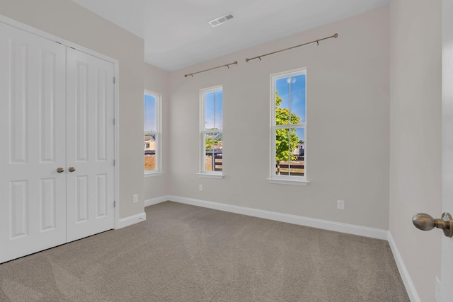 513 Perrin Aly, Antioch, TN 37013 - unfurnished bedroom featuring carpet, a closet, and baseboards