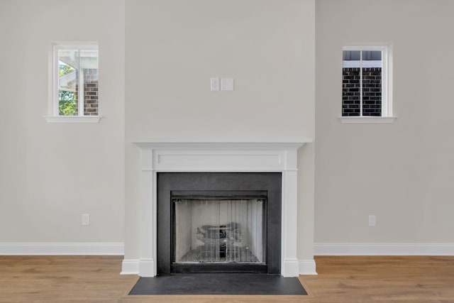 513 Perrin Aly, Antioch, TN 37013 - detailed view of wood finished floors, a fireplace with flush hearth, and baseboards