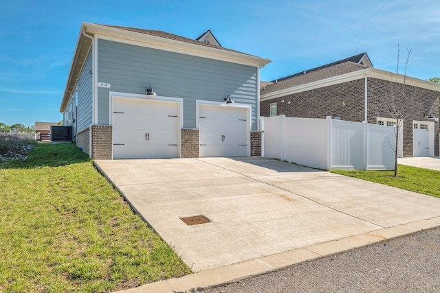 513 Perrin Aly, Antioch, TN 37013 - view of side of property with brick siding, a garage, and concrete driveway