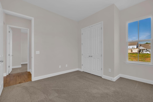 513 Perrin Aly, Antioch, TN 37013 - unfurnished bedroom featuring carpet floors, baseboards, and a closet