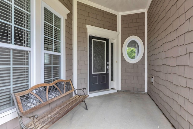 doorway to property featuring covered porch