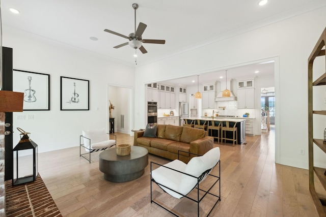 7214 Neills Branch Dr, College Grove, TN 37046 - living room with light wood-style flooring, a ceiling fan, ornamental molding, and recessed lighting