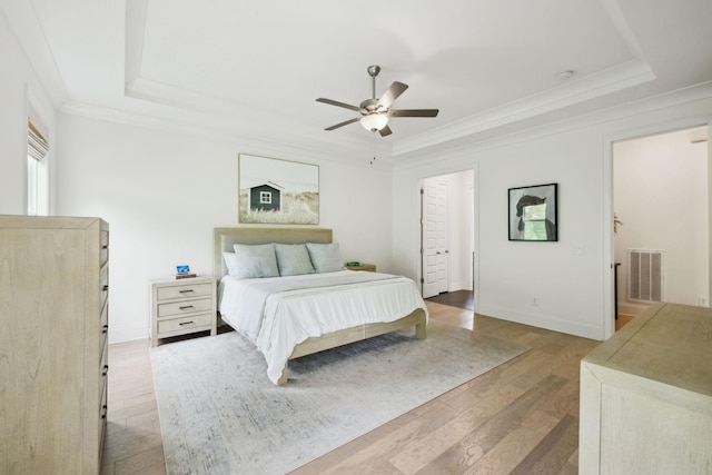 7214 Neills Branch Dr, College Grove, TN 37046 - bedroom featuring a raised ceiling, light wood-type flooring, ornamental molding, baseboards, and ceiling fan