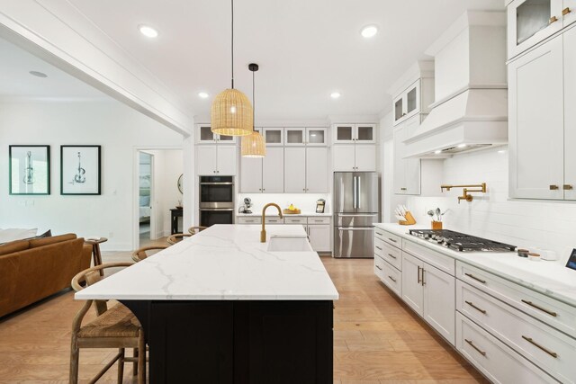 7214 Neills Branch Dr, College Grove, TN 37046 - kitchen with stainless steel appliances, a sink, custom exhaust hood, tasteful backsplash, and decorative light fixtures