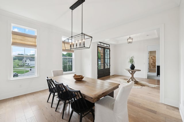 7214 Neills Branch Dr, College Grove, TN 37046 - dining room featuring light wood-style floors, baseboards, a chandelier, ornamental molding, and a tray ceiling