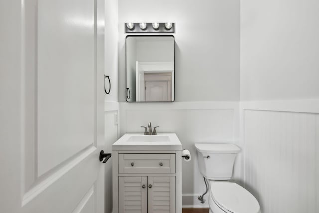 503 Mable Mason Cv, La Vergne, TN 37086 - bathroom with a wainscoted wall, vanity, toilet, and a decorative wall