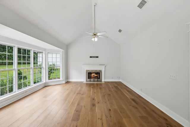 503 Mable Mason Cv, La Vergne, TN 37086 - unfurnished living room with hardwood / wood-style floors, a ceiling fan, a fireplace with flush hearth, baseboards, and lofted ceiling