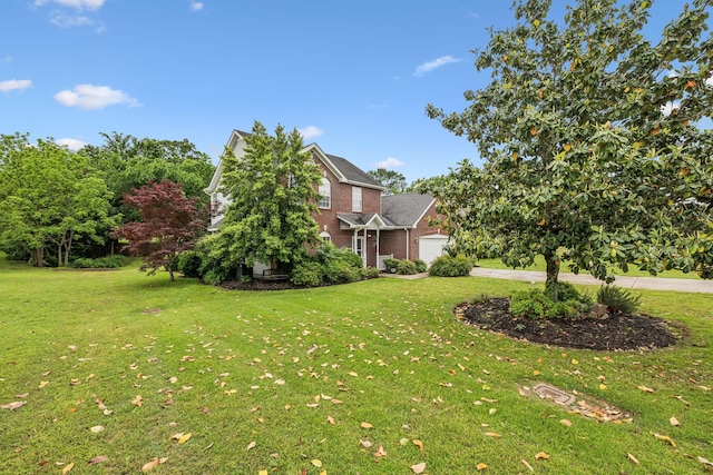 503 Mable Mason Cv, La Vergne, TN 37086 - view of grassy yard with an attached garage and driveway