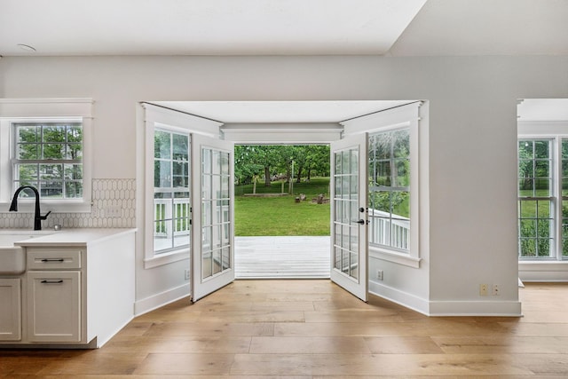 503 Mable Mason Cv, La Vergne, TN 37086 - doorway featuring light wood-type flooring, french doors, baseboards, and a sink