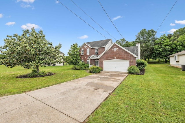 503 Mable Mason Cv, La Vergne, TN 37086 - view of front facade featuring brick siding, a front lawn, an attached garage, and driveway