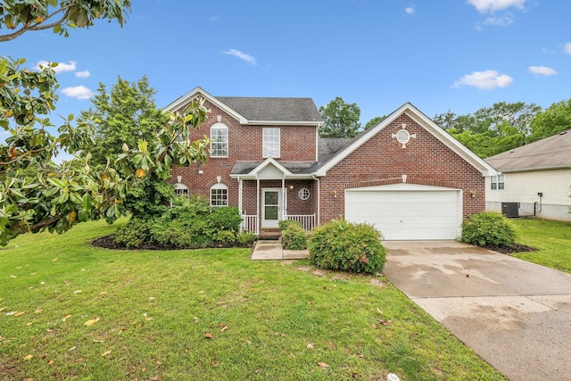 503 Mable Mason Cv, La Vergne, TN 37086 - view of front of home with brick siding, a garage, concrete driveway, a front lawn, and central AC
