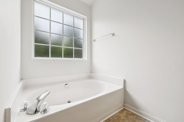 503 Mable Mason Cv, La Vergne, TN 37086 - full bathroom featuring a garden tub and tile patterned floors