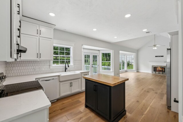 503 Mable Mason Cv, La Vergne, TN 37086 - kitchen with wooden counters, a sink, white dishwasher, open floor plan, and ceiling fan