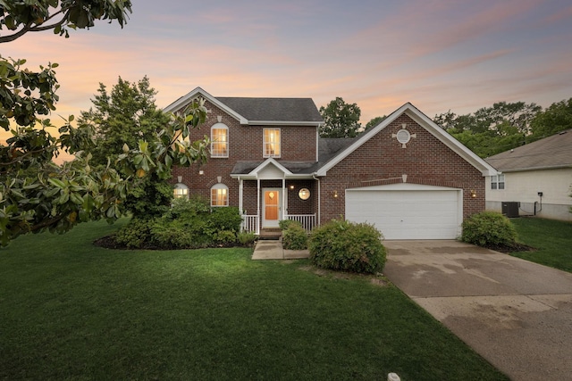 503 Mable Mason Cv, La Vergne, TN 37086 - traditional-style house with brick siding, concrete driveway, a garage, and a lawn