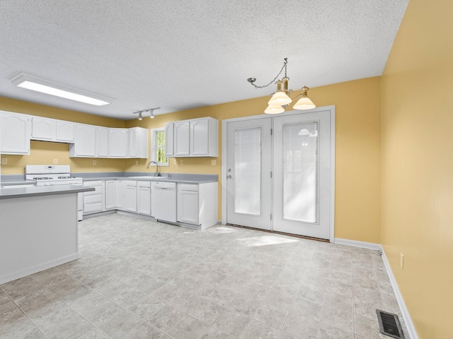 kitchen with white appliances, a textured ceiling, white cabinetry, light countertops, and a sink