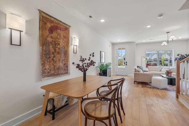 dining area with light wood finished floors, recessed lighting, and baseboards
