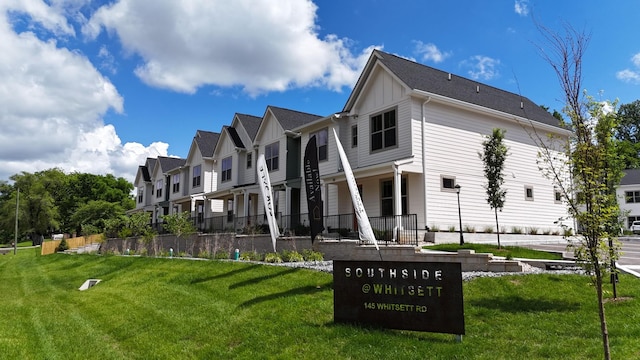 view of community with a lawn and a residential view