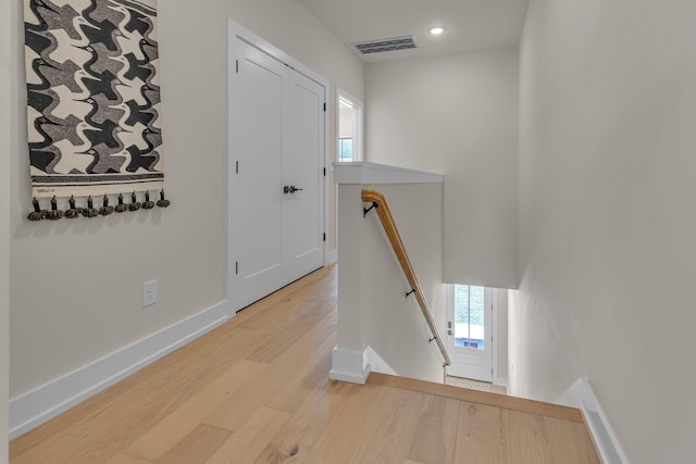 entrance foyer featuring light wood-type flooring, baseboards, healthy amount of natural light, and recessed lighting
