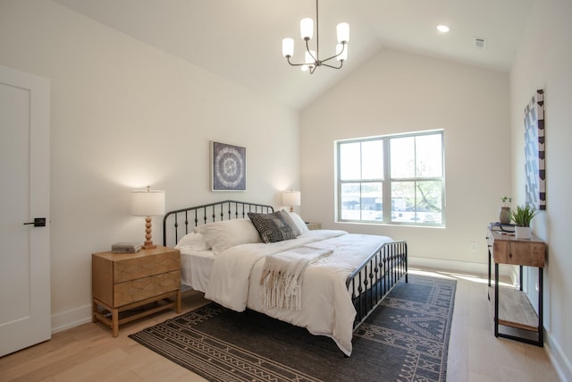 bedroom with a chandelier, wood finished floors, baseboards, high vaulted ceiling, and recessed lighting