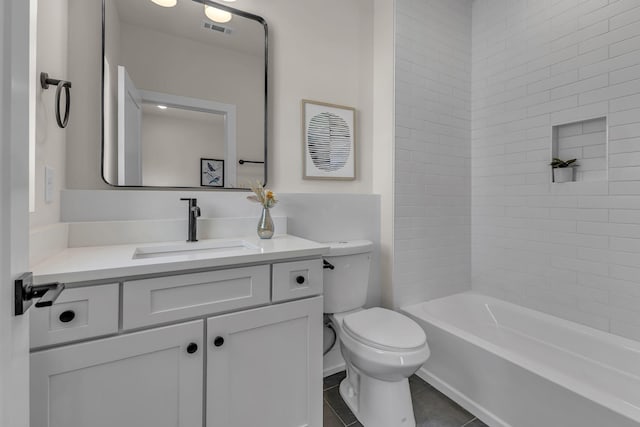 bathroom featuring toilet, vanity, tile patterned floors, and bathtub / shower combination