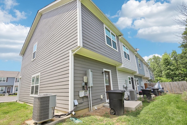 rear view of property with cooling unit