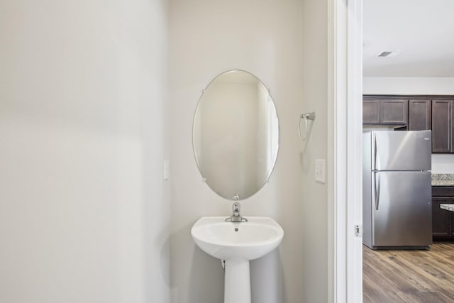 bathroom with wood finished floors