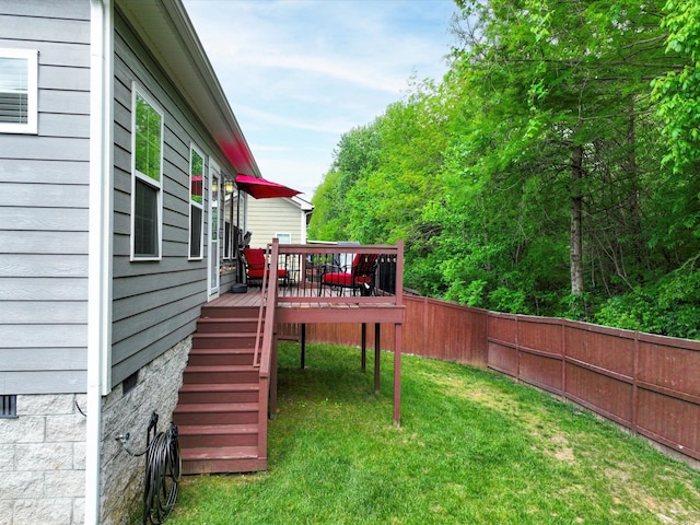 view of yard with a deck and stairs